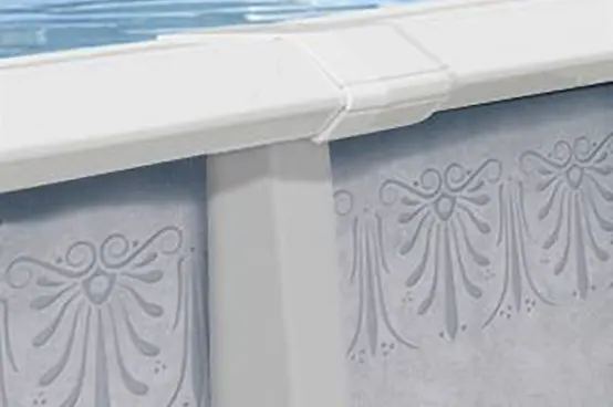 Above-ground pool wall featuring decorative embossed pattern and white trim