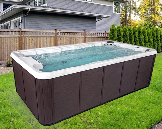 Spacious rectangular hot tub with dark exterior in residential backyard setting