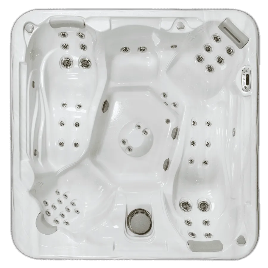 Overhead view of white hot tub spa equipment with multiple jets and controls